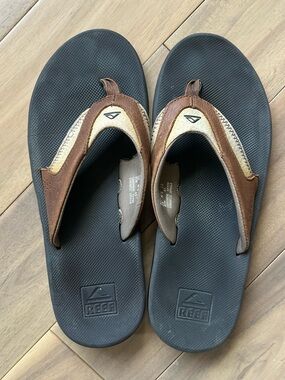 Reef Brown Leather Flip Flops with Black Footbed
